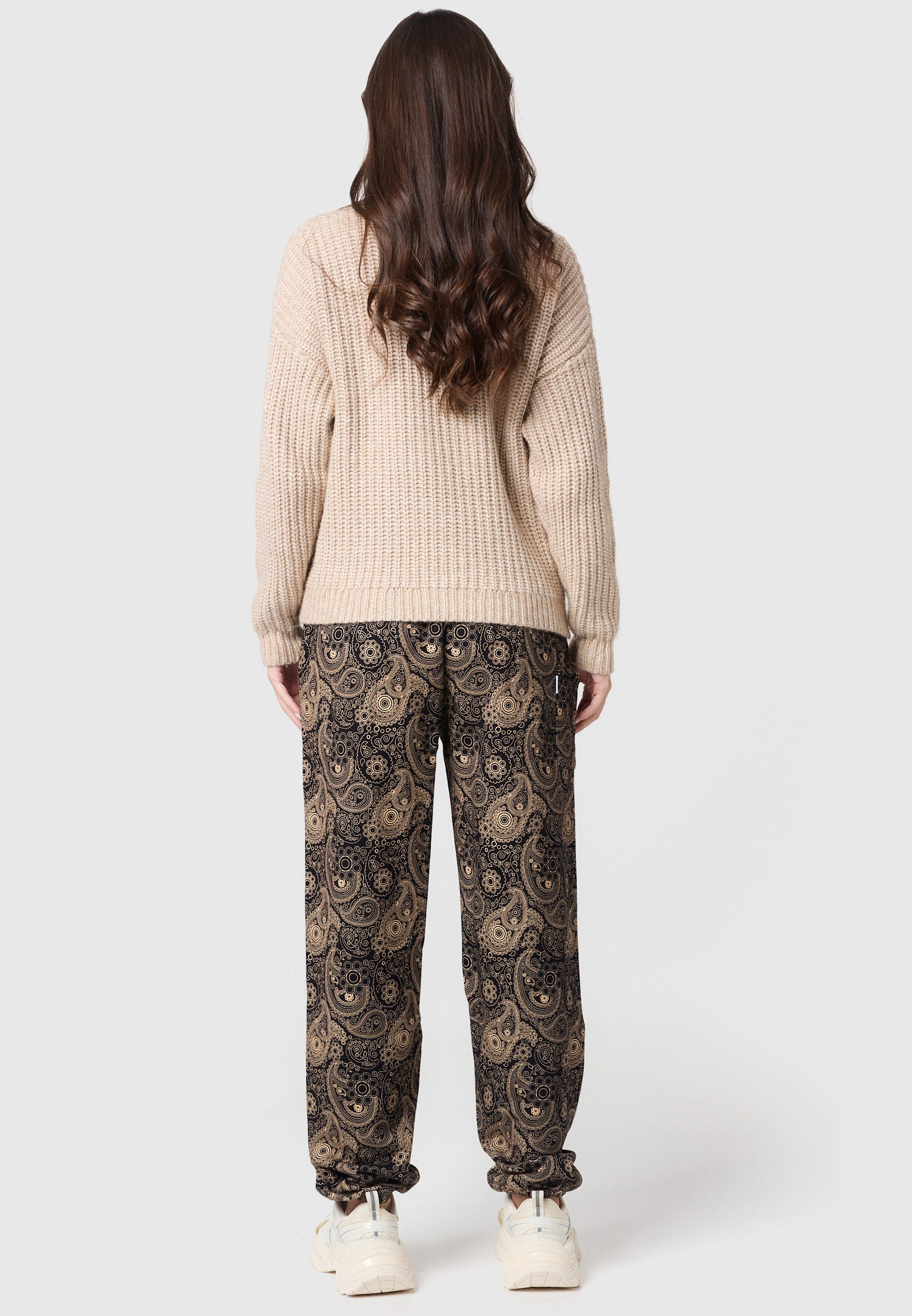 Pantalones bombachos cálidos con adornos dorados